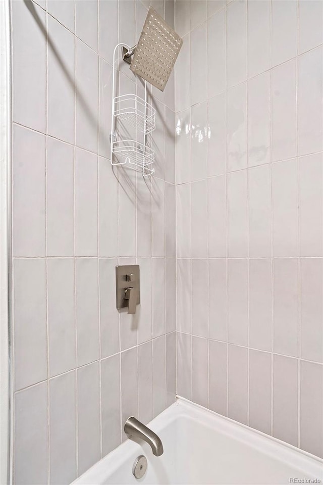 bathroom with shower / bath combination