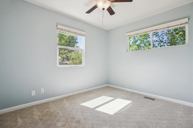 765 Iola St, Aurora, CO 80010 - carpeted spare room with healthy amount of natural light, baseboards, and ceiling fan