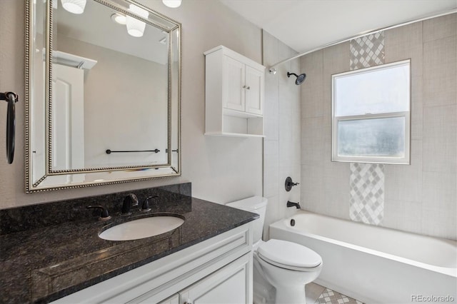 765 Iola St, Aurora, CO 80010 - bathroom featuring vanity, toilet, and bathtub / shower combination