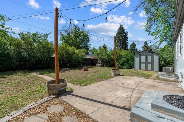 765 Iola St, Aurora, CO 80010 - view of yard with central AC and a patio area