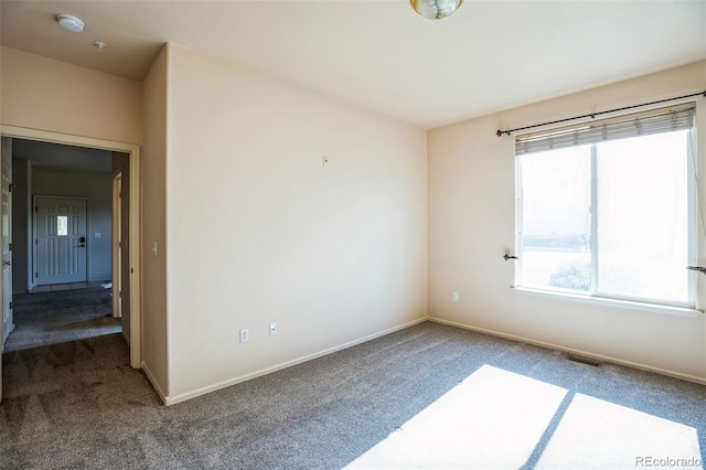 2491 Fountain Greens Blvd Unit B1, Grand Junction, CO 81505 - carpeted spare room featuring a smoke detector and baseboards