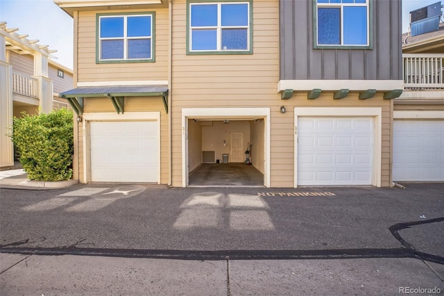 2491 Fountain Greens Blvd Unit B1, Grand Junction, CO 81505 - view of front of home featuring board and batten siding and a garage