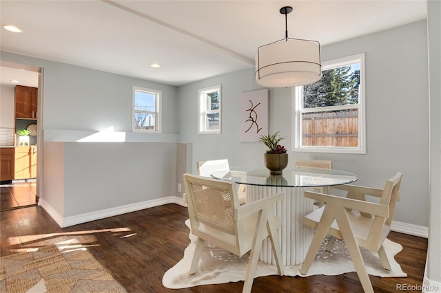 dining area with dark hardwood / wood-style flooring