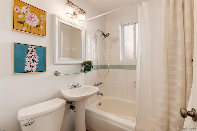 bathroom with shower / bathtub combination with curtain and toilet