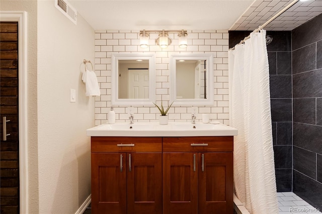 bathroom with tasteful backsplash, vanity, and a shower with shower curtain