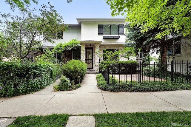 549 Milwaukee St, Denver, CO 80206 - view of front of home with stucco siding and stone siding