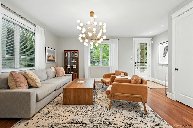 549 Milwaukee St, Denver, CO 80206 - living area featuring wood finished floors, healthy amount of natural light, recessed lighting, and a chandelier