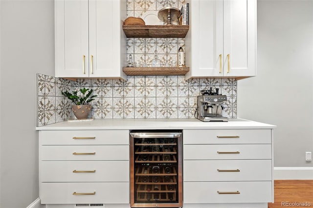 549 Milwaukee St, Denver, CO 80206 - indoor dry bar featuring wine cooler and decorative backsplash