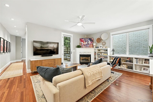 549 Milwaukee St, Denver, CO 80206 - living room with ceiling fan, wood finished floors, a premium fireplace, and recessed lighting