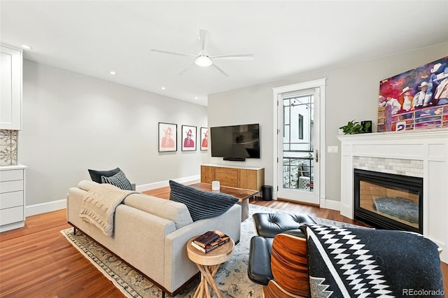 549 Milwaukee St, Denver, CO 80206 - living room with a ceiling fan, light wood-style flooring, recessed lighting, and a fireplace