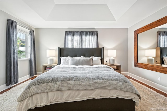 549 Milwaukee St, Denver, CO 80206 - bedroom with a tray ceiling and wood finished floors