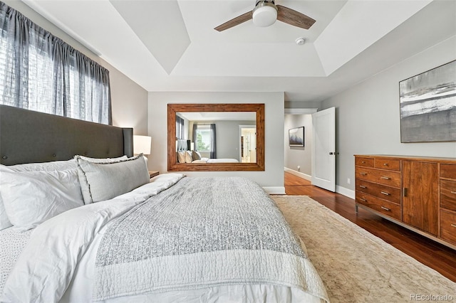 549 Milwaukee St, Denver, CO 80206 - bedroom featuring a raised ceiling, dark wood-type flooring, and ceiling fan