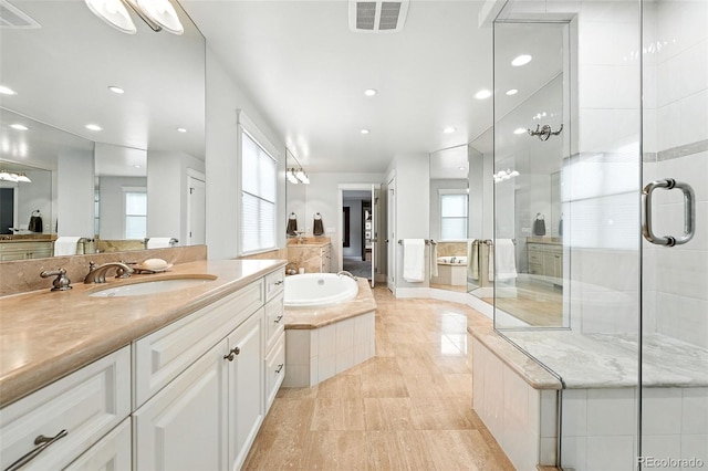 549 Milwaukee St, Denver, CO 80206 - full bathroom featuring a stall shower, vanity, a garden tub, recessed lighting, and tile patterned flooring
