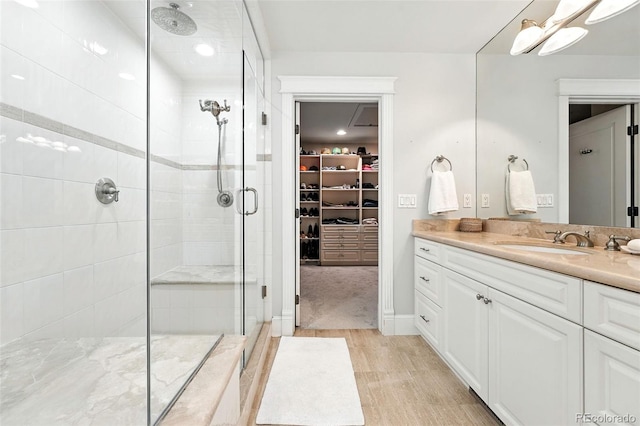 549 Milwaukee St, Denver, CO 80206 - full bathroom featuring a shower stall, vanity, and a spacious closet