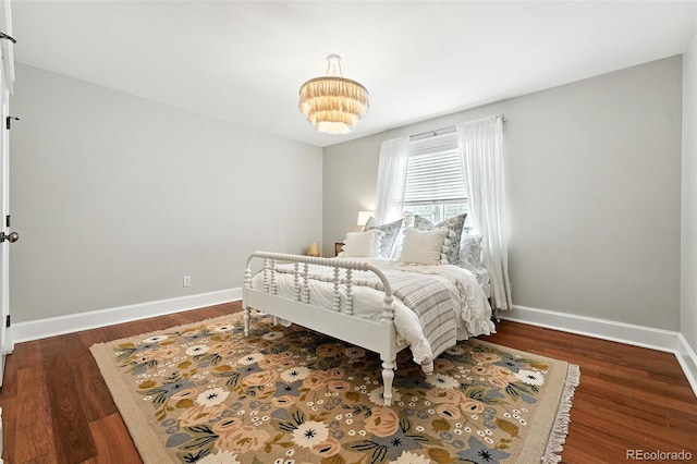 549 Milwaukee St, Denver, CO 80206 - bedroom with wood finished floors and a chandelier