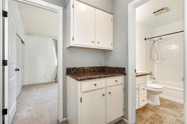 full bathroom featuring bathing tub / shower combination, vanity, and toilet