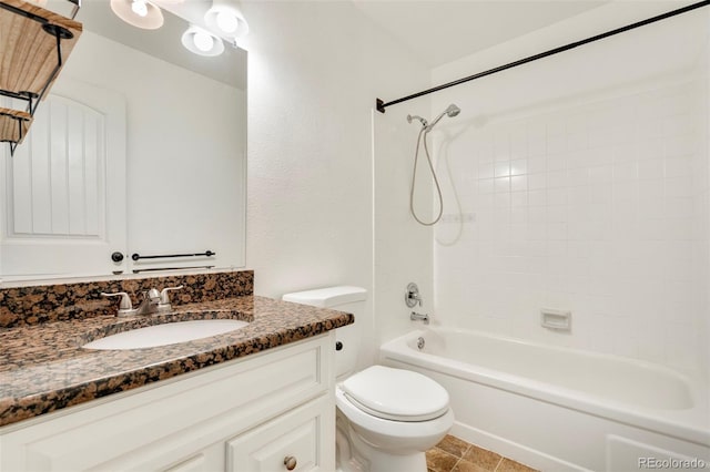 bathroom featuring vanity, toilet, and shower / washtub combination