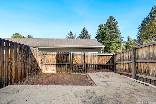 view of yard with a patio area and a fenced backyard