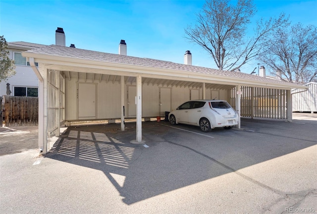 covered parking lot with fence