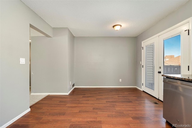 entryway with visible vents, baseboards, and wood finished floors