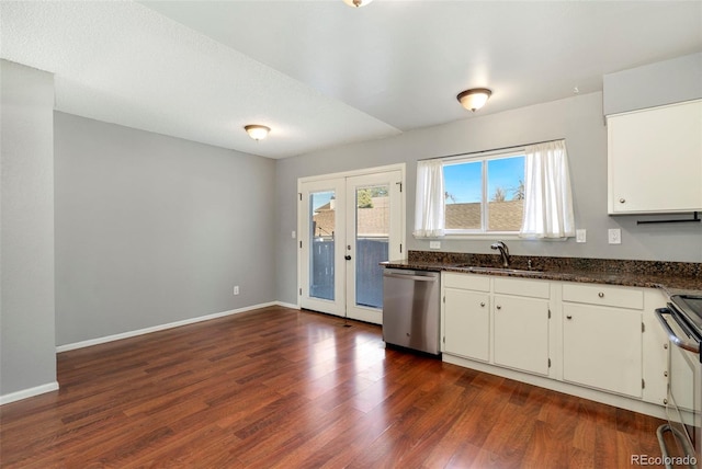 kitchen with a sink, baseboards, french doors, stainless steel appliances, and dark wood-style flooring