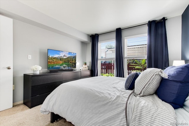 bedroom featuring light carpet