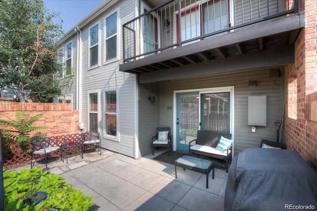 view of patio featuring a balcony