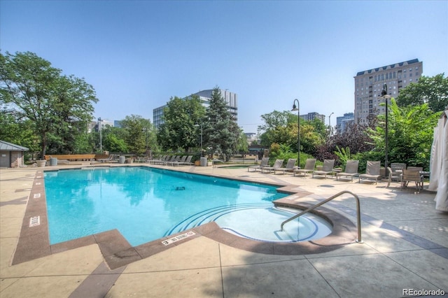 view of swimming pool with a patio area