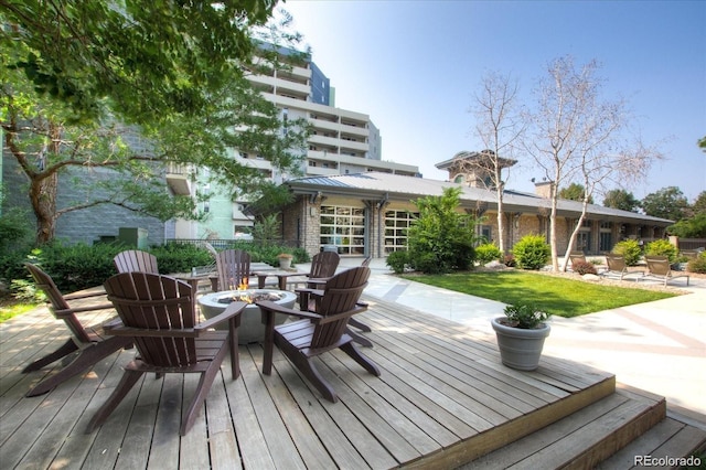 deck with a patio area and a fire pit