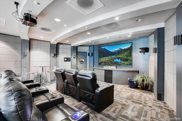 home theater room featuring light carpet