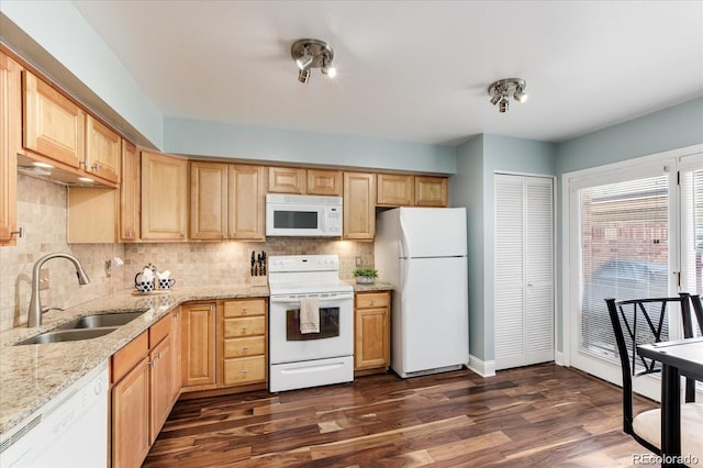 kitchen with dark hardwood / wood-style floors, light brown cabinetry, tasteful backsplash, sink, and white appliances