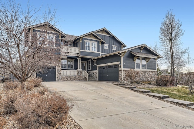 craftsman house with covered porch and a garage