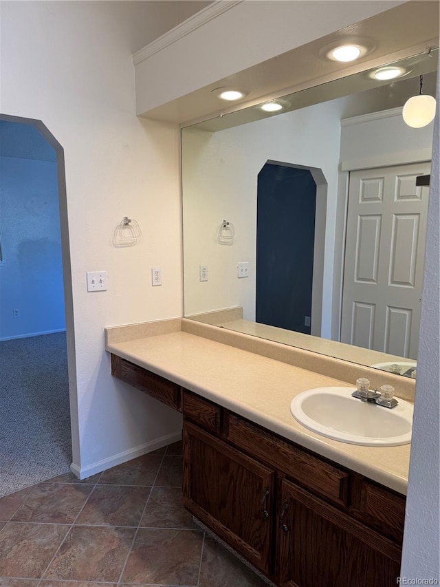 bathroom with tile patterned flooring and vanity