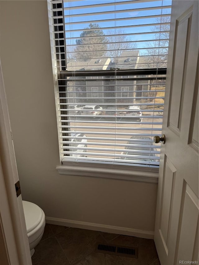 bathroom featuring tile patterned floors and toilet