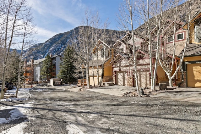 exterior space featuring a mountain view and a garage