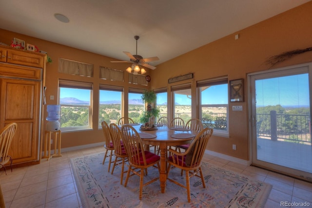 dining space featuring a wealth of natural light, ceiling fan, and light tile patterned floors