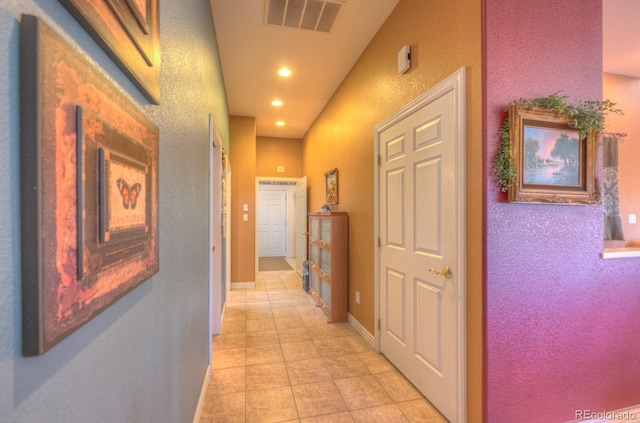 hall featuring light tile patterned floors