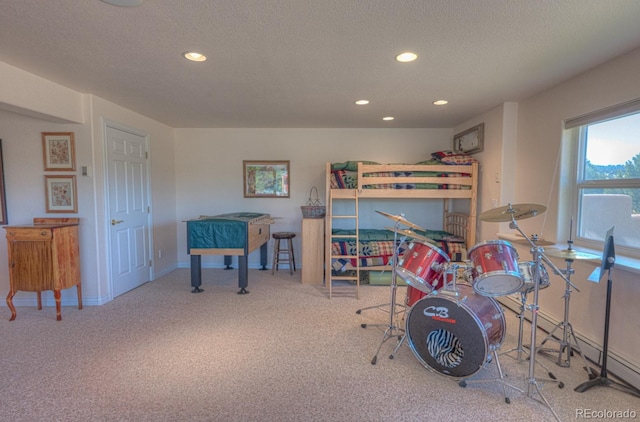 carpeted bedroom featuring a textured ceiling