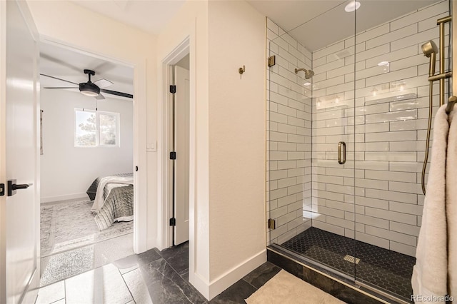 2037 Mockingbird Trl, Bailey, CO 80421 - bathroom featuring connected bathroom, a shower stall, a ceiling fan, baseboards, and marble finish flooring