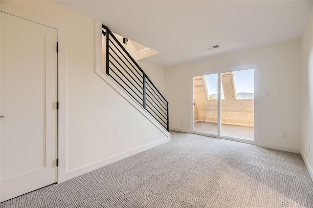 2037 Mockingbird Trl, Bailey, CO 80421 - unfurnished room with stairs, light colored carpet, and baseboards