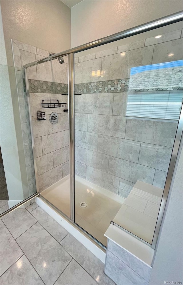 full bath featuring a shower stall