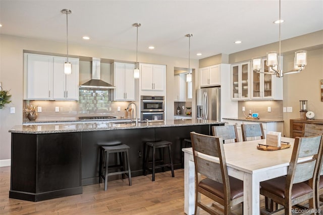 350 Andromeda Ln, Castle Rock, CO 80108 - dining room with light wood-style floors, recessed lighting, and a chandelier