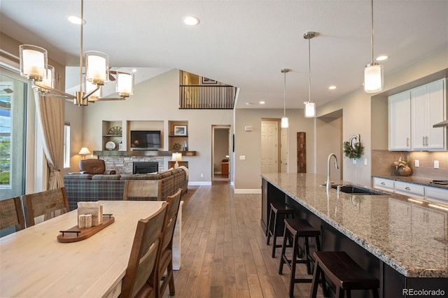 350 Andromeda Ln, Castle Rock, CO 80108 - dining space featuring dark wood-type flooring, a fireplace, and recessed lighting