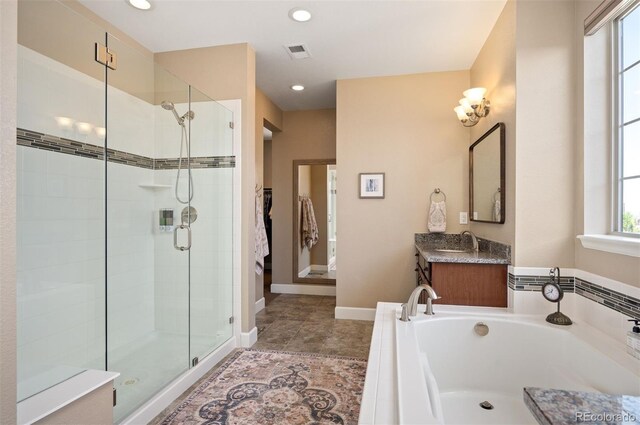 350 Andromeda Ln, Castle Rock, CO 80108 - bathroom featuring a stall shower, a garden tub, vanity, recessed lighting, and tile patterned flooring