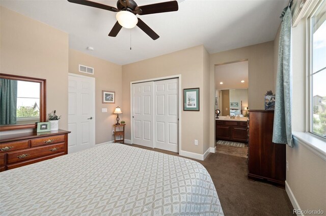 350 Andromeda Ln, Castle Rock, CO 80108 - bedroom featuring dark carpet, multiple windows, a closet, and a ceiling fan