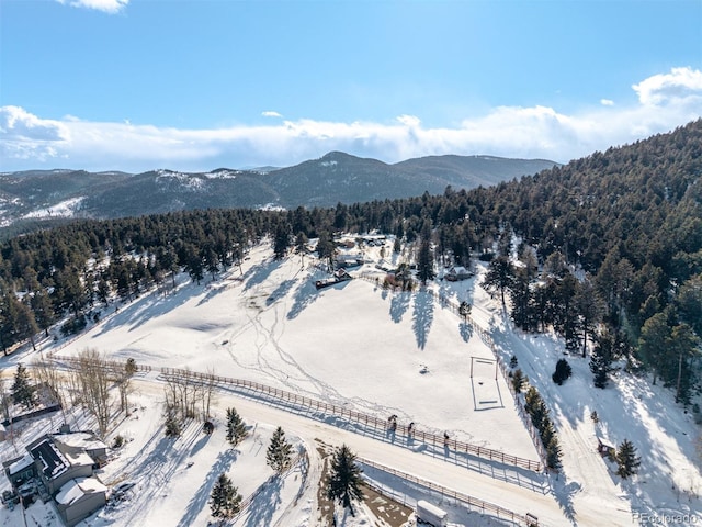 snowy aerial view with a mountain view