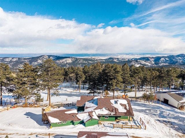 snowy aerial view with a mountain view