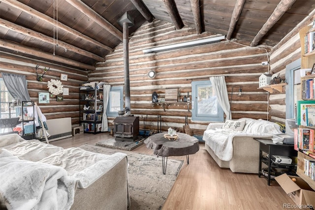 8537 S Doubleheader Hwy, Morrison, CO 80465 - living area featuring a wood stove, rustic walls, wood ceiling, and wood finished floors