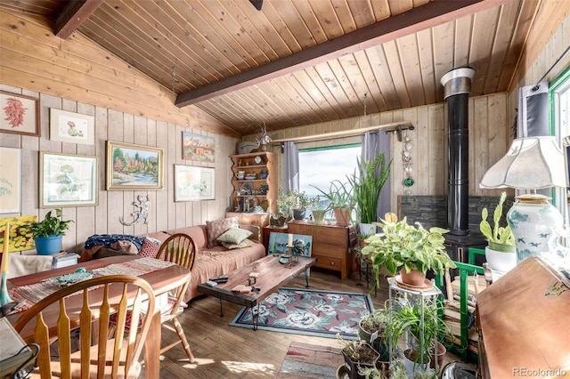 8537 S Doubleheader Hwy, Morrison, CO 80465 - living area featuring wood walls, hardwood / wood-style flooring, wooden ceiling, and a wood stove