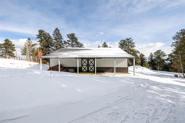 8537 S Doubleheader Hwy, Morrison, CO 80465 - snow covered structure with an outbuilding